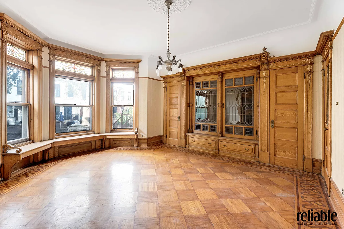 dining room with built-ins, window seat, lincrusta