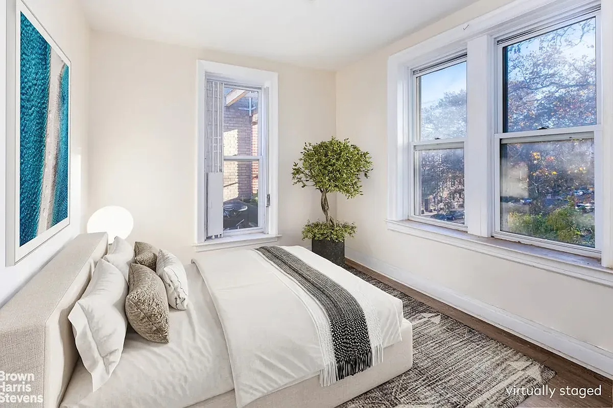 virtually staged bedroom with bed and area rug