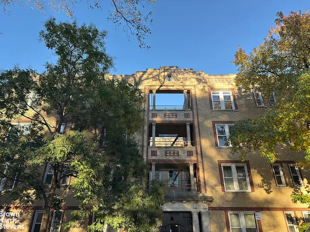 building with pale brick and red brick accents