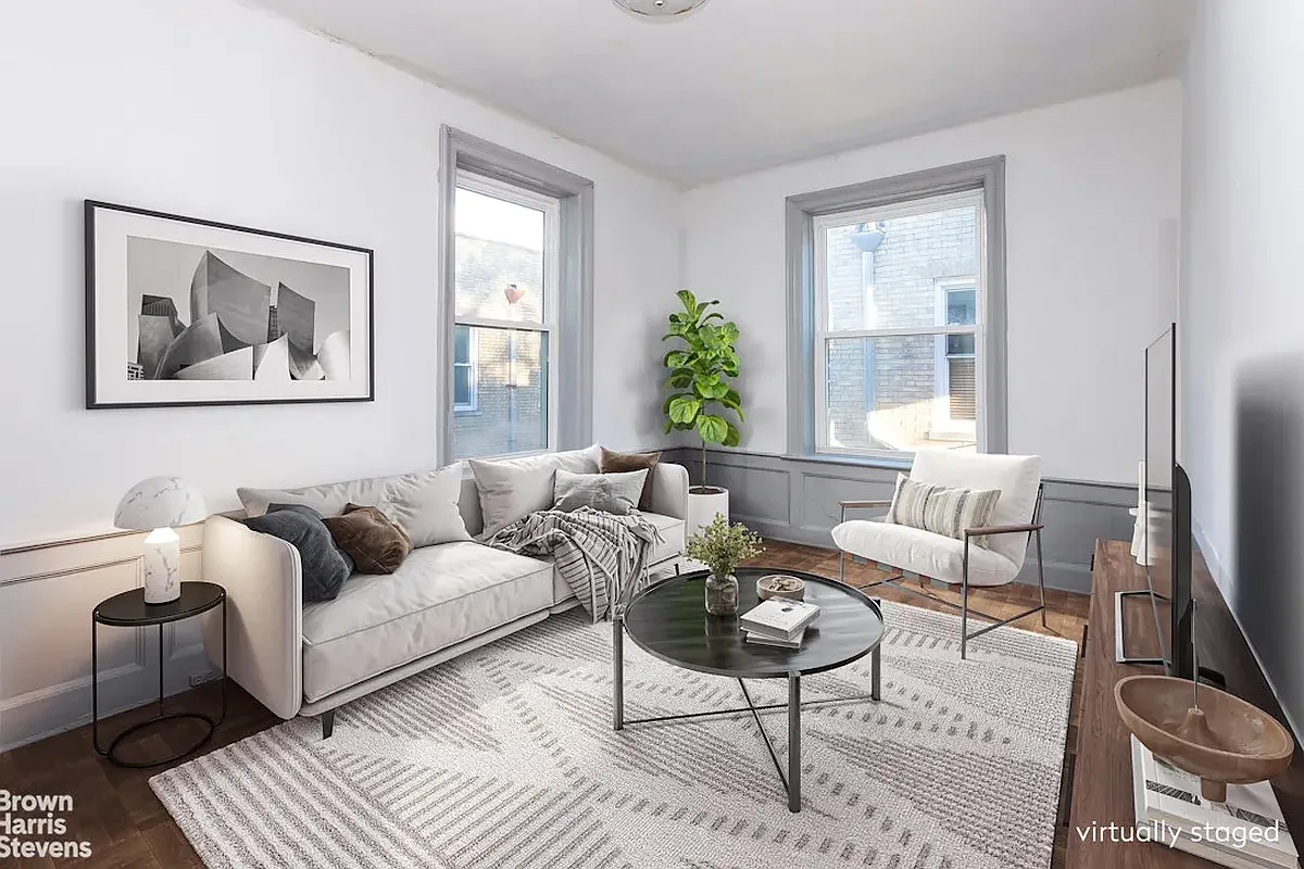 virtually staged living room with a sofa 