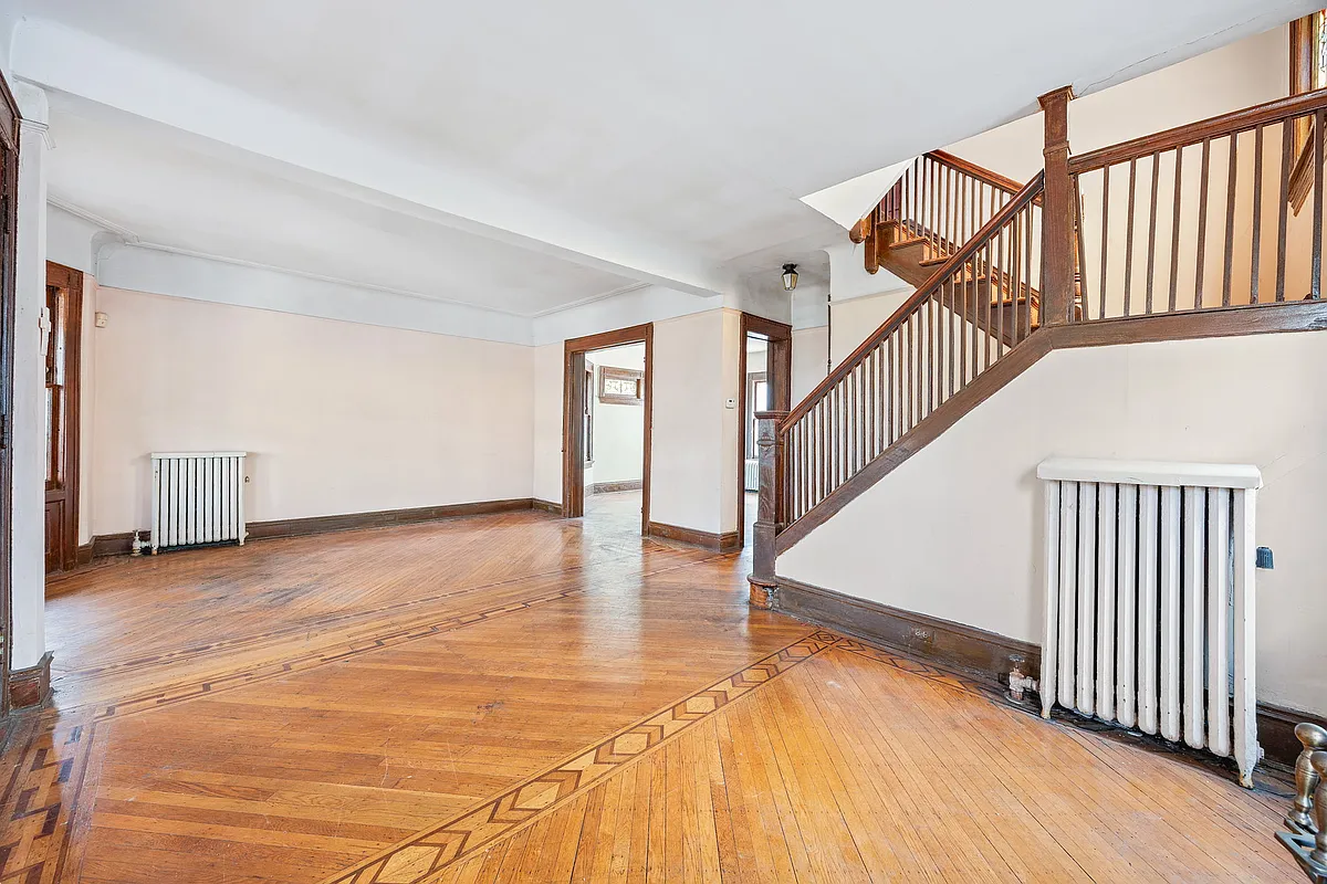 parlor with staircase, wood floor