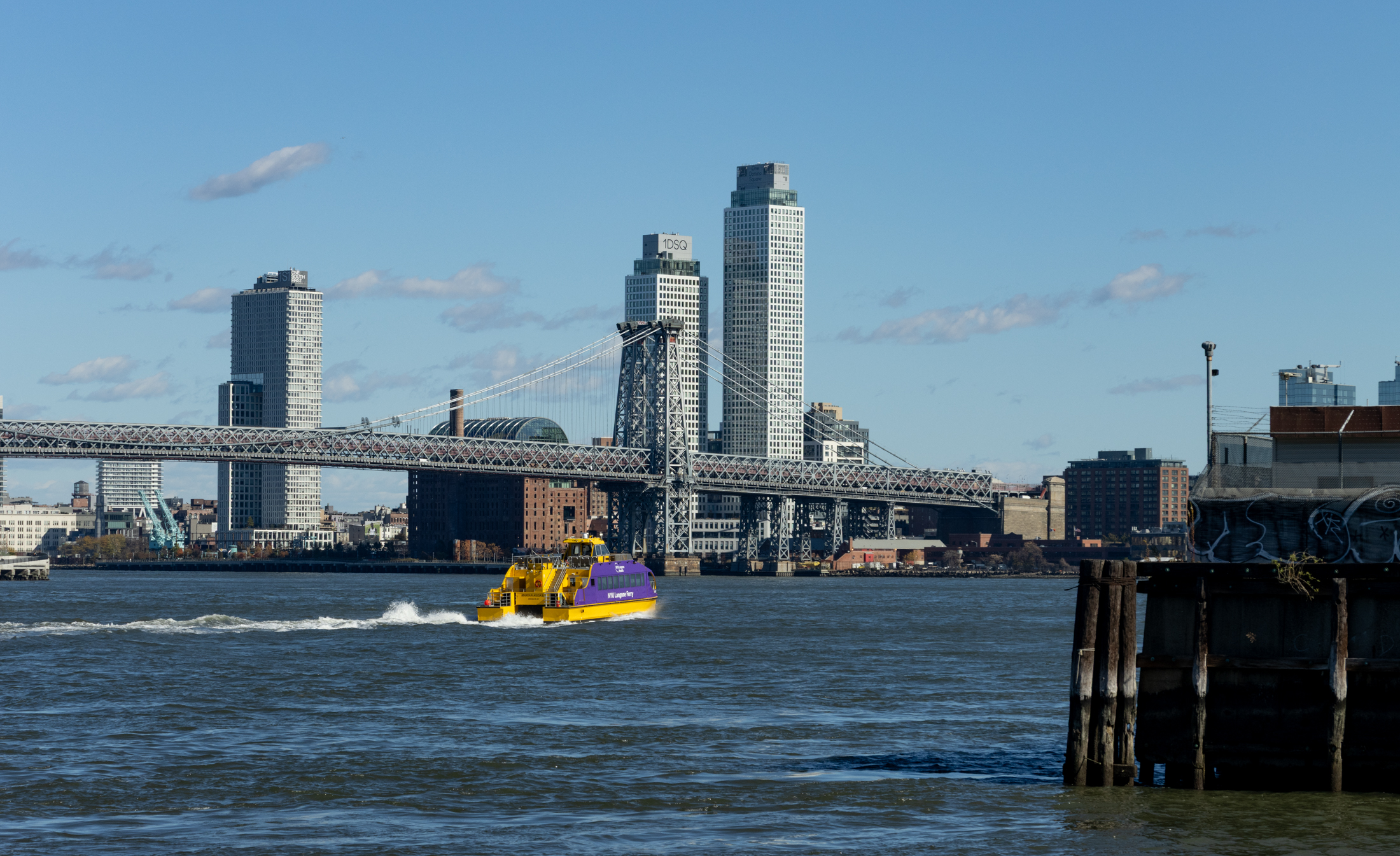 waterfront view of williamsburg with bridge and domino in view