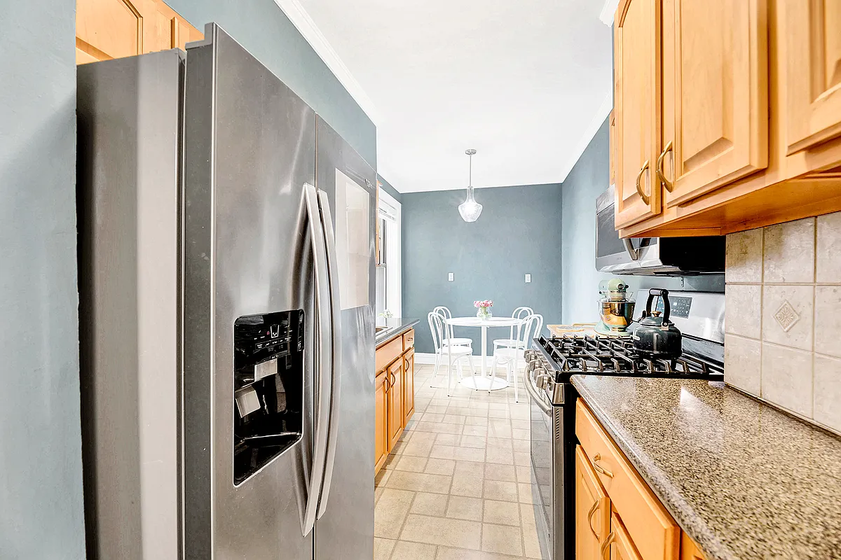 kitchen with blue walls, wood cabinets