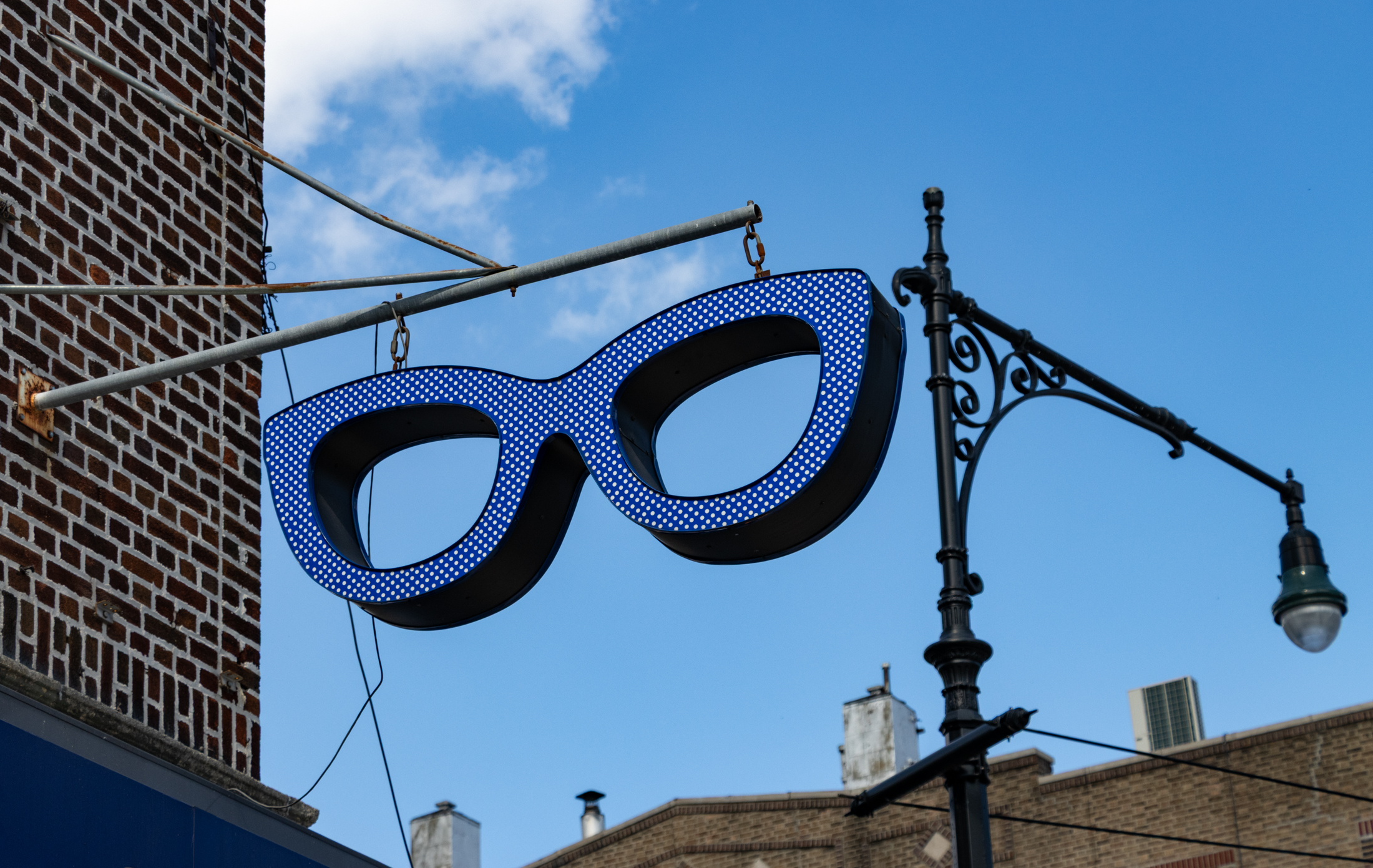 sign in the shape of giant eyeglasses