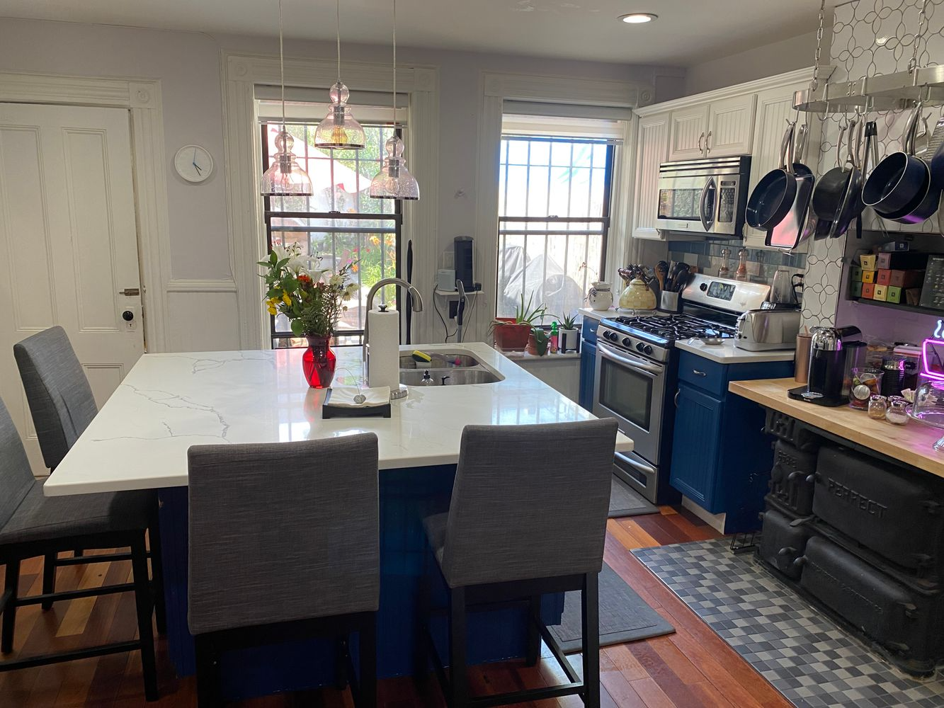 kitchen with large island, blue and white cabinets