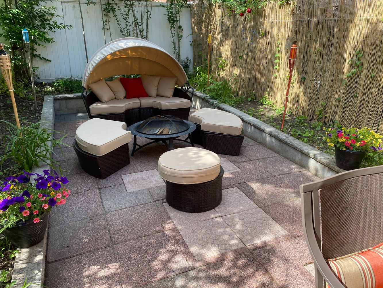 rear yard with seating, planting beds