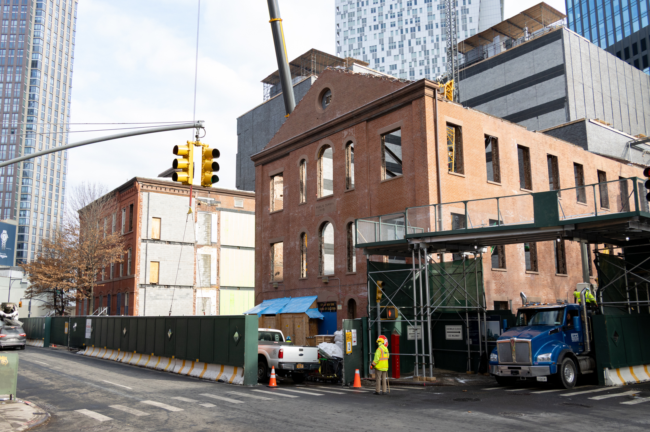 brick school buildings amidst construction