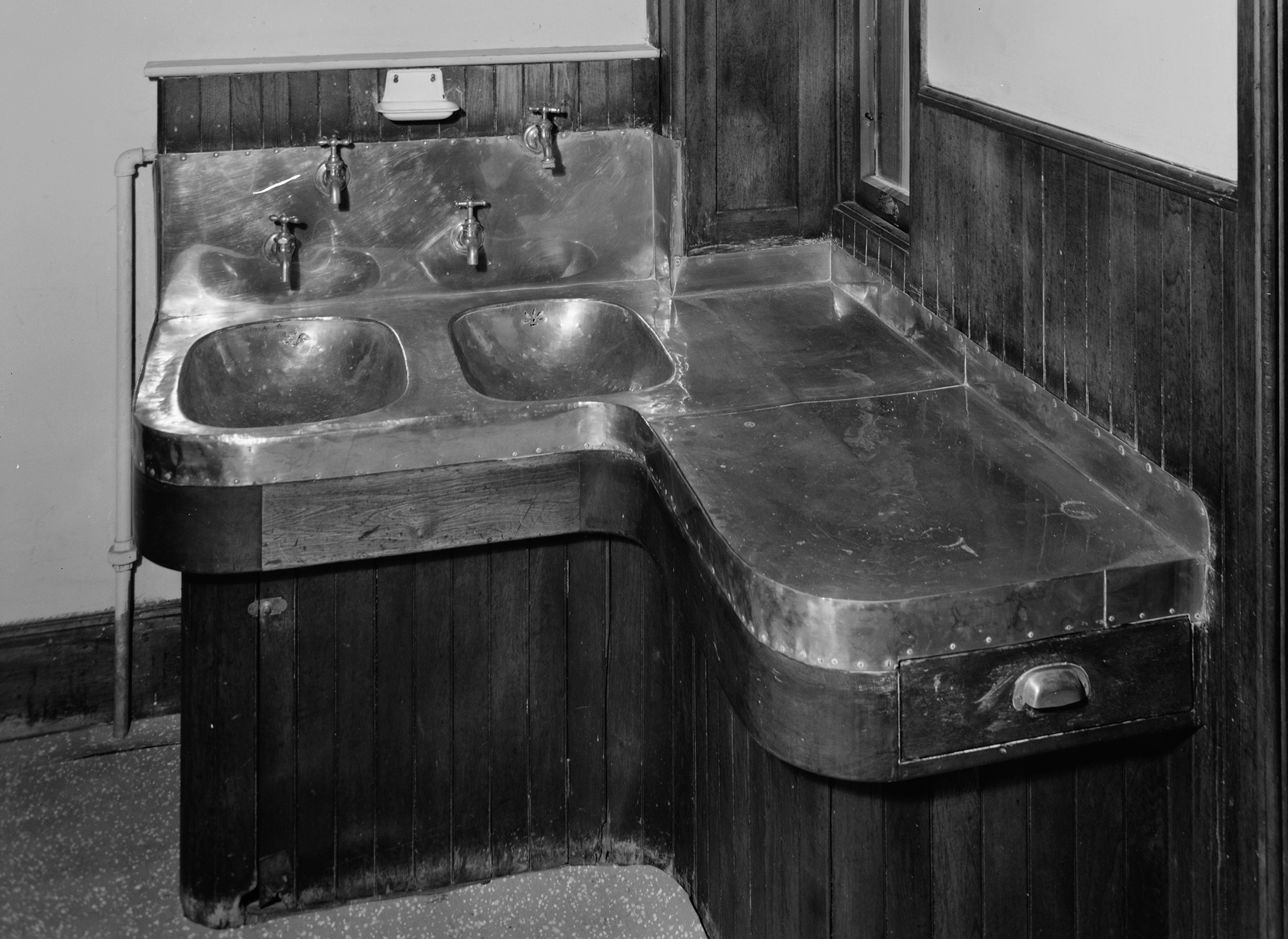 black and white photo of a sink