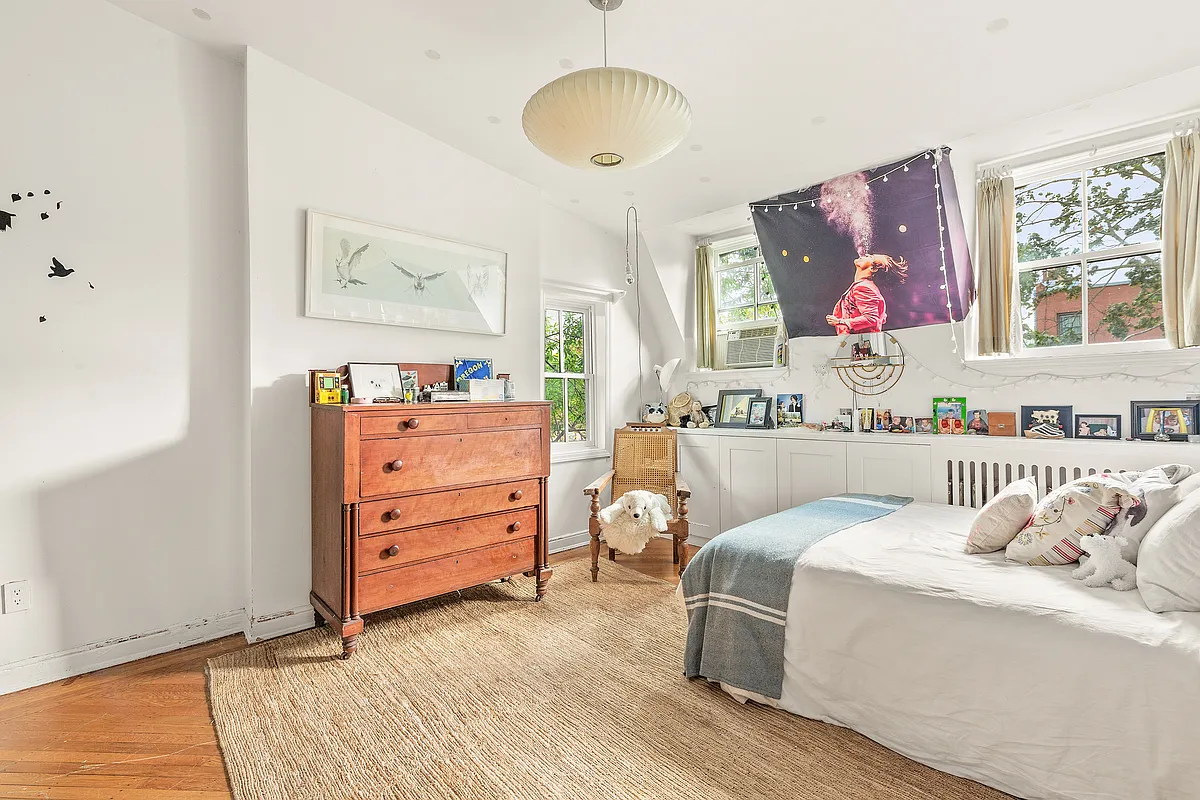 bedroom with white walls, built-in storage