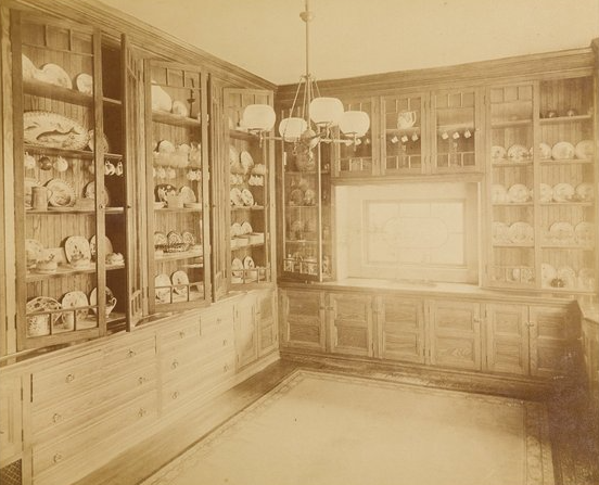 pantry with shelves filled with dishes