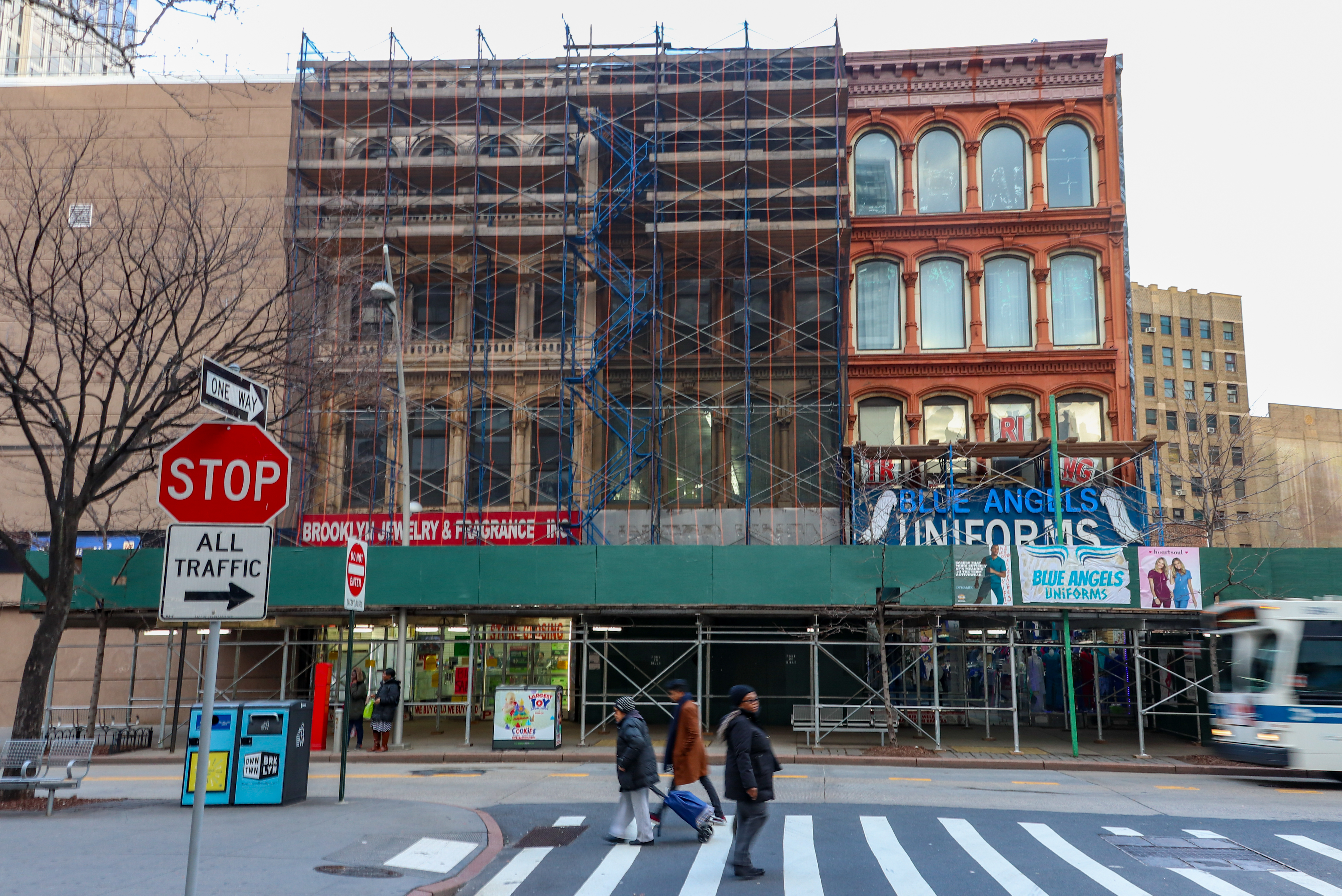 buildings with cast iron fronts under scaffolding