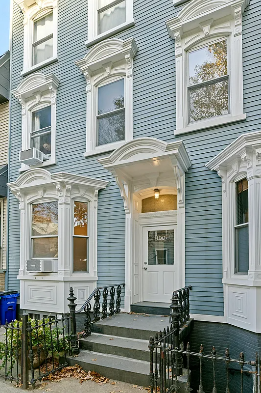 wood frame exterior with bay windows