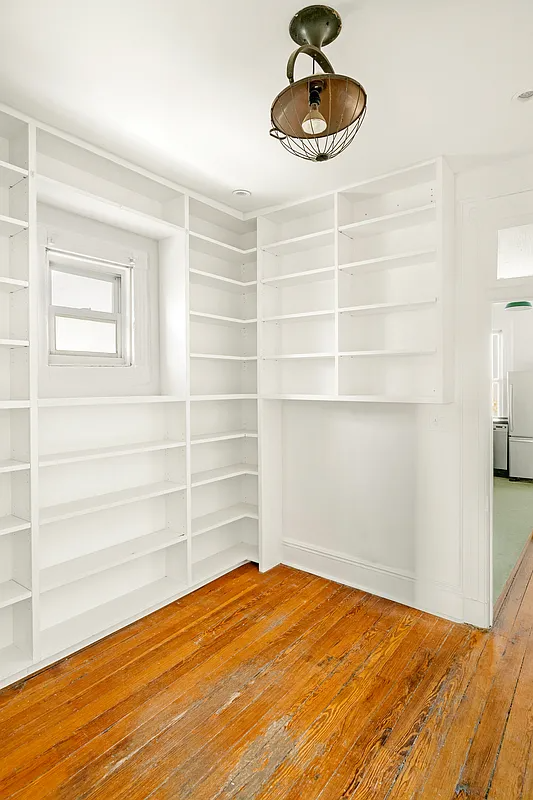 office with built-in shelves painted white
