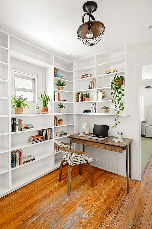 virtually staged office with white shelves