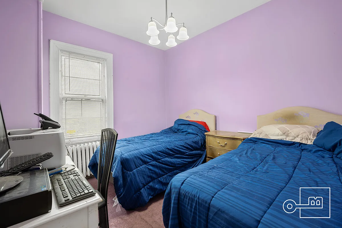 bedroom with purple walls and carpet