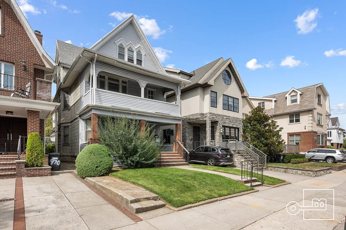 house exterior with white siding, double porches