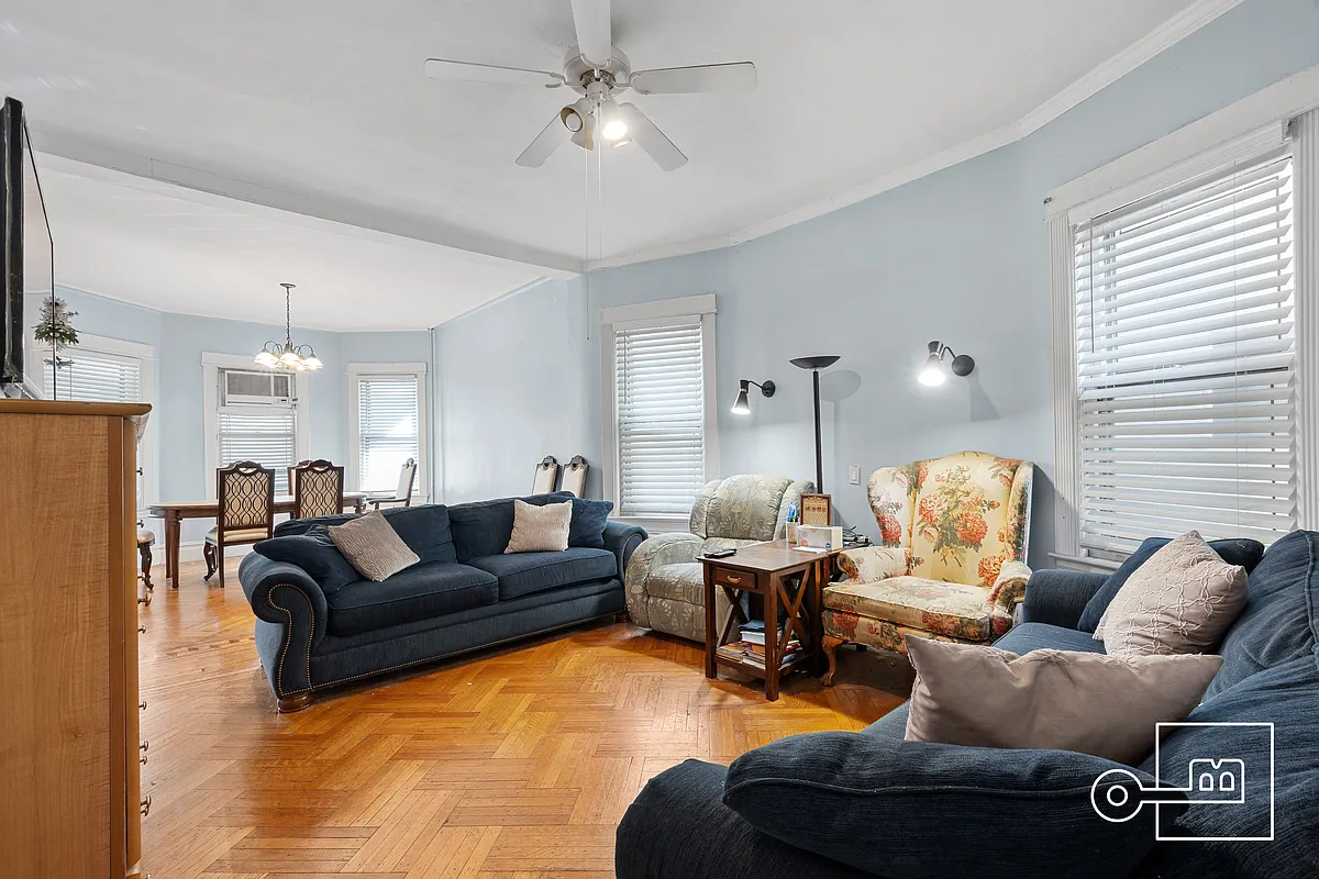 living room with wood floor, pale blue walls