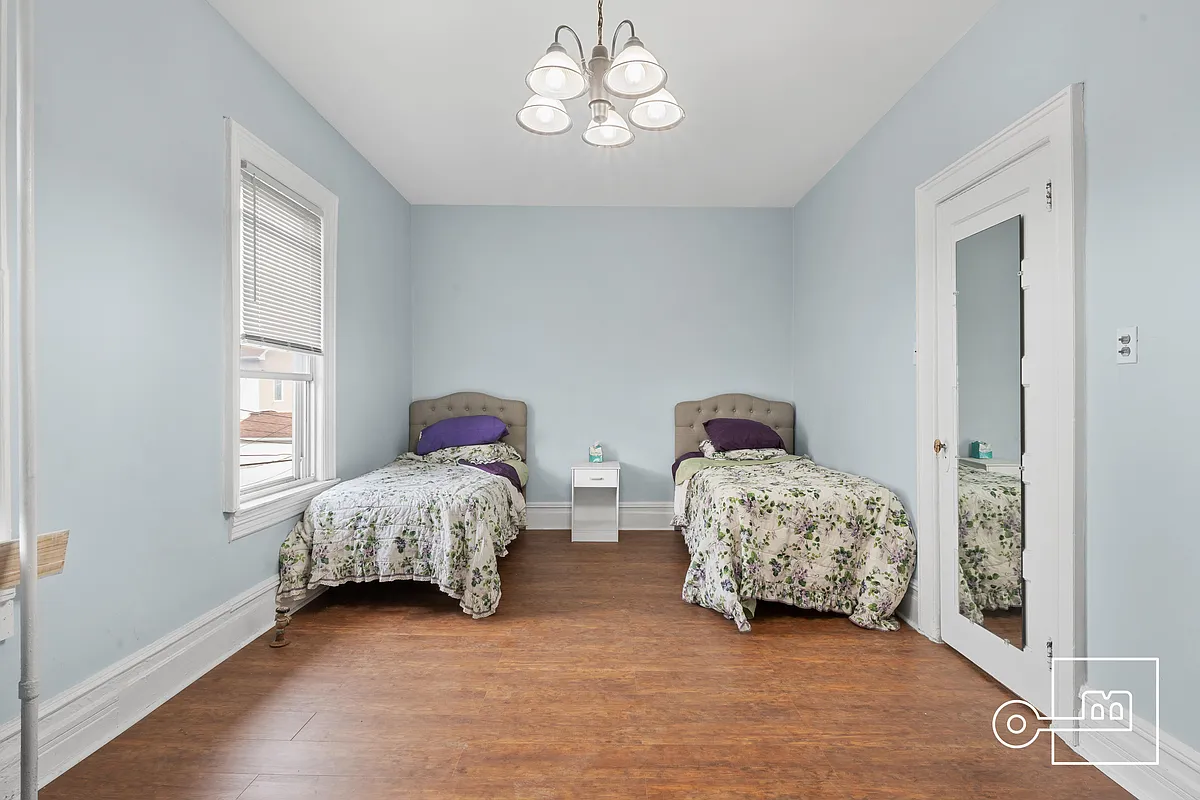 bedroom with two windows and a closet
