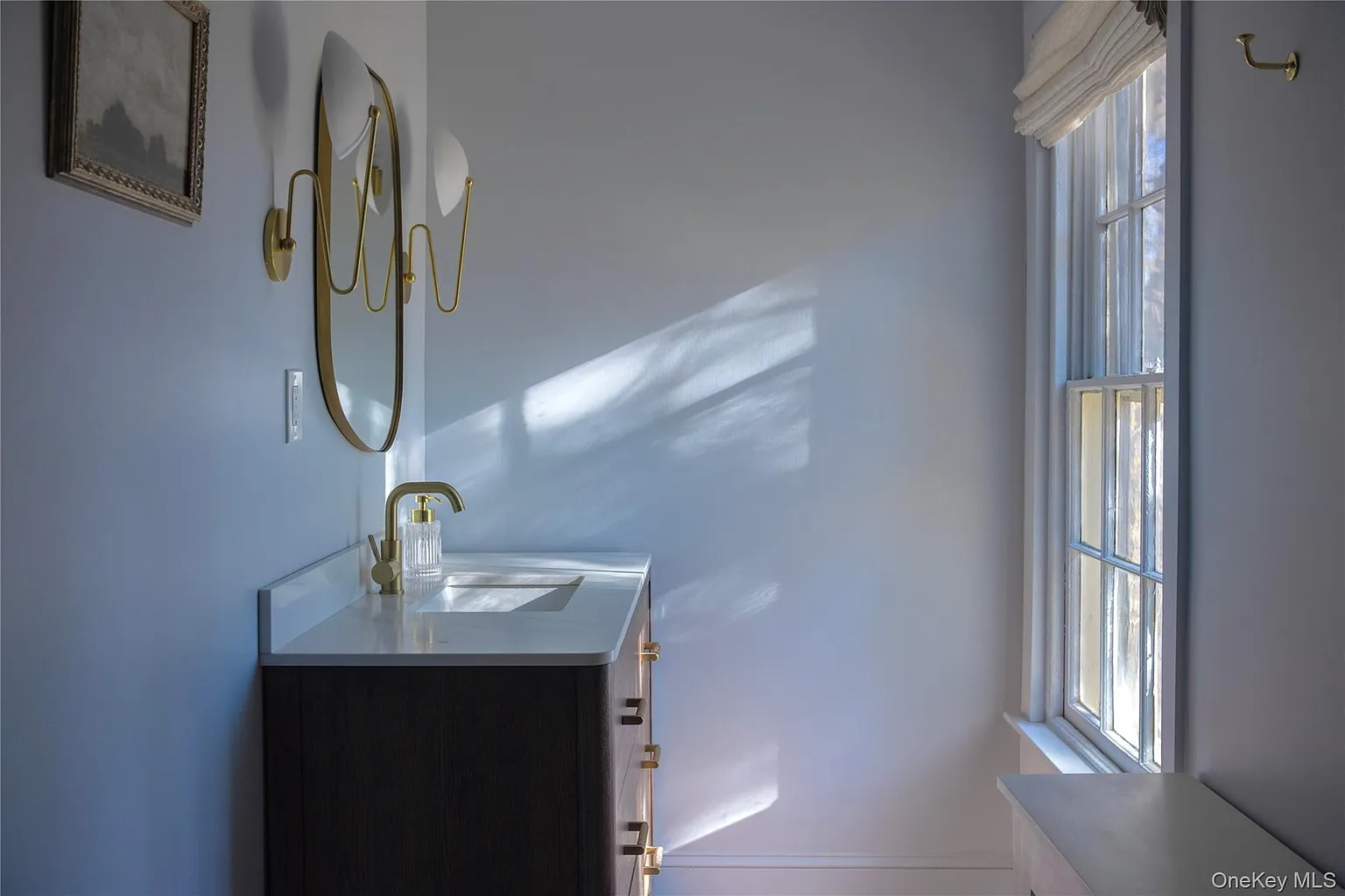 bathroom with wood vanity