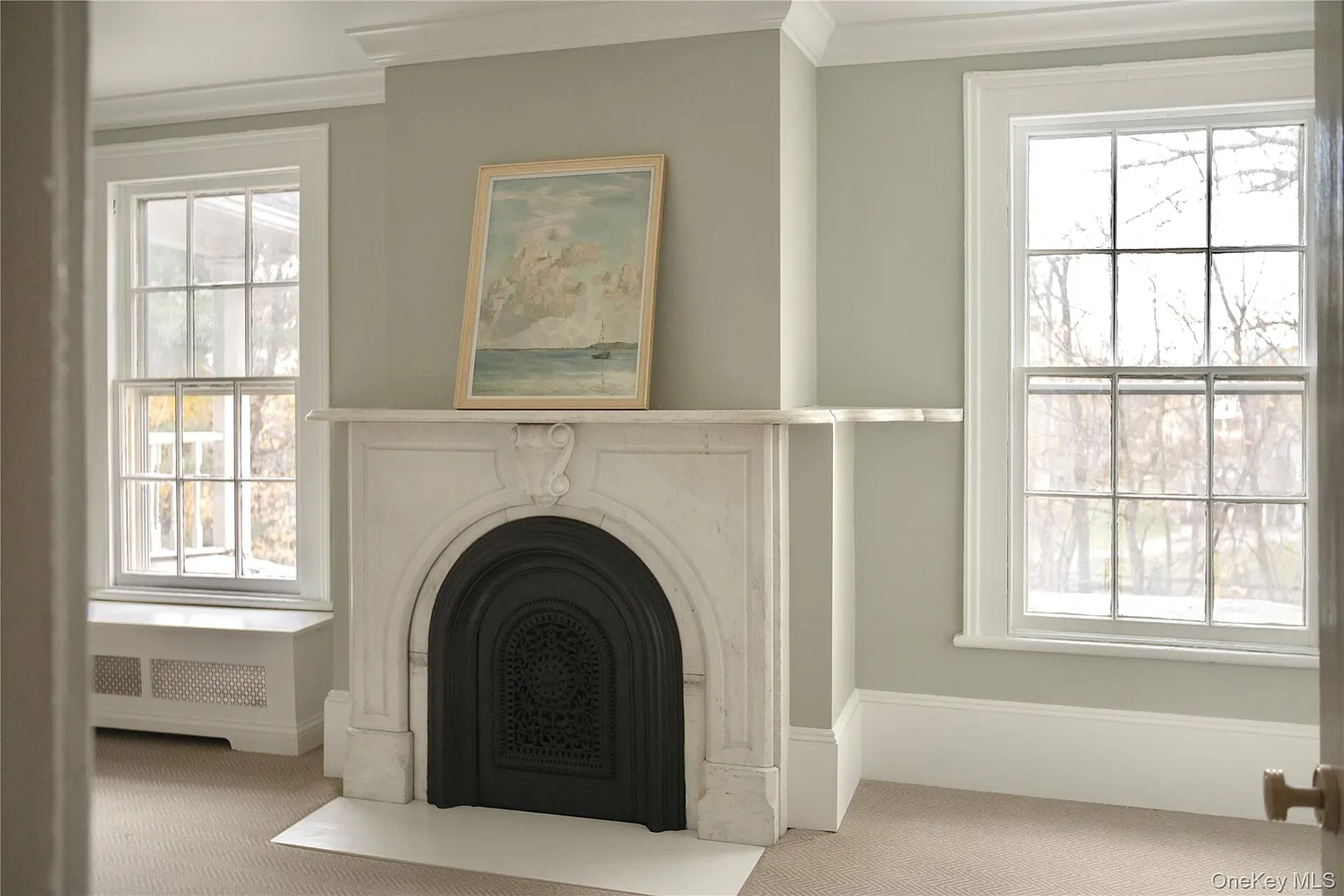 marble mantel in a room with carpeting