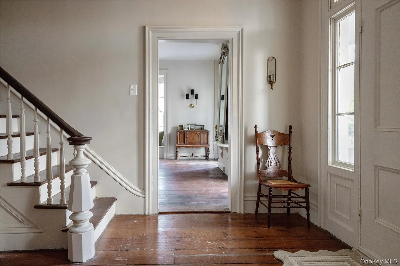 entry with wood floor, stair