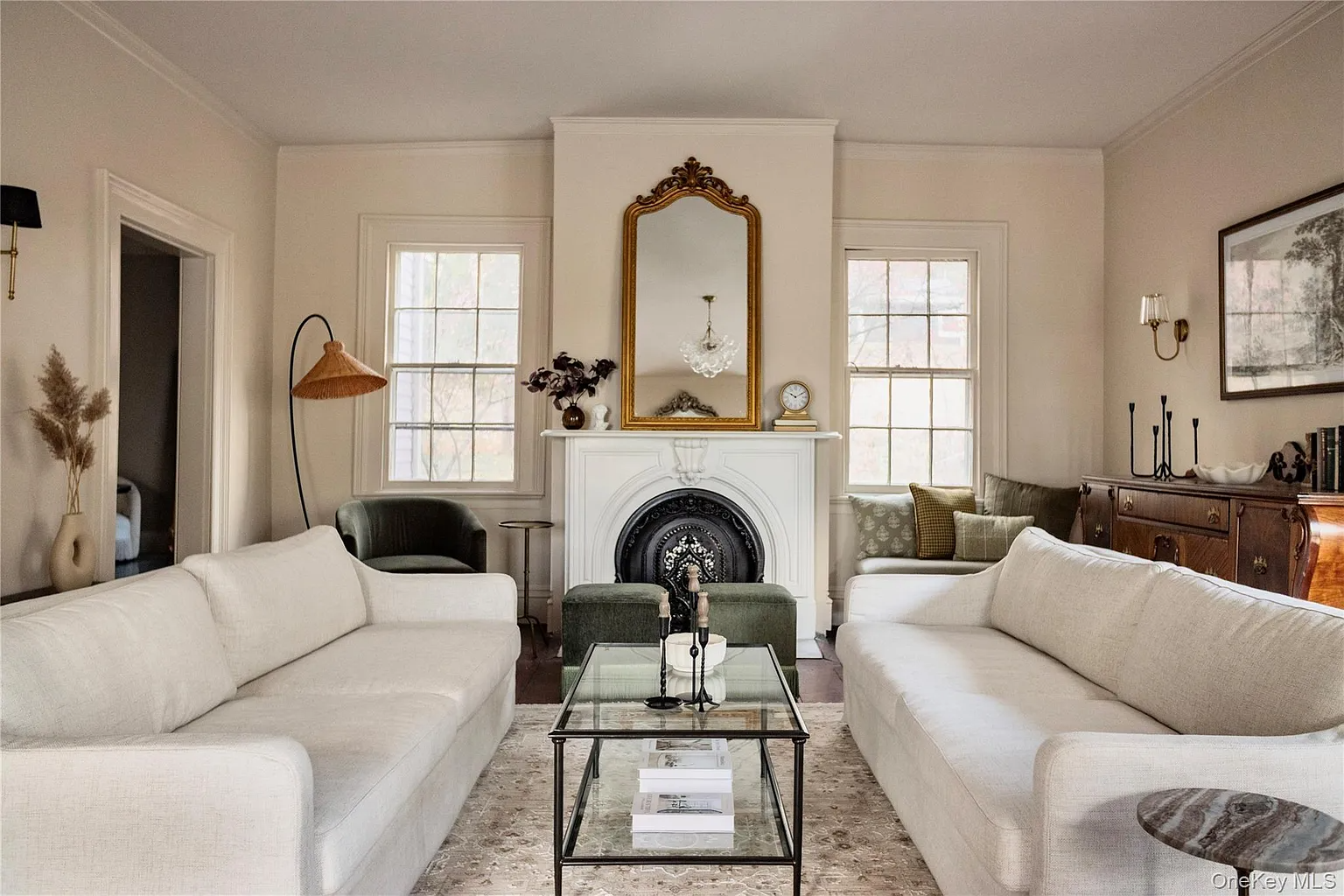parlor with wood floors, marble mantel