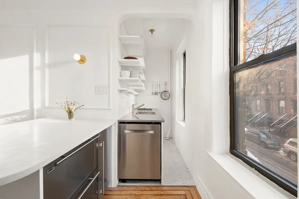 kitchen with open shelving, under the counter appliances