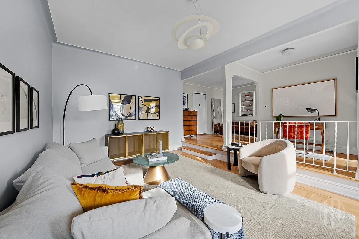sunken living room with rail around dining area