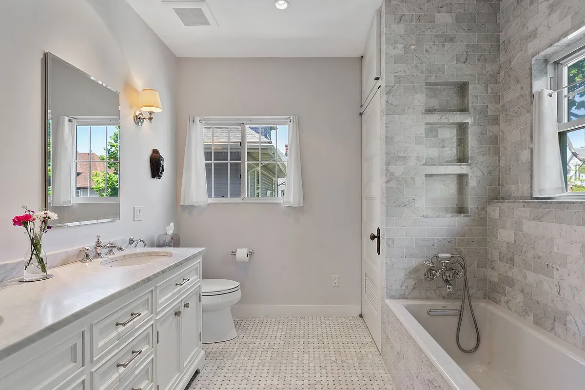 bathroom with white fixtures, greige tile