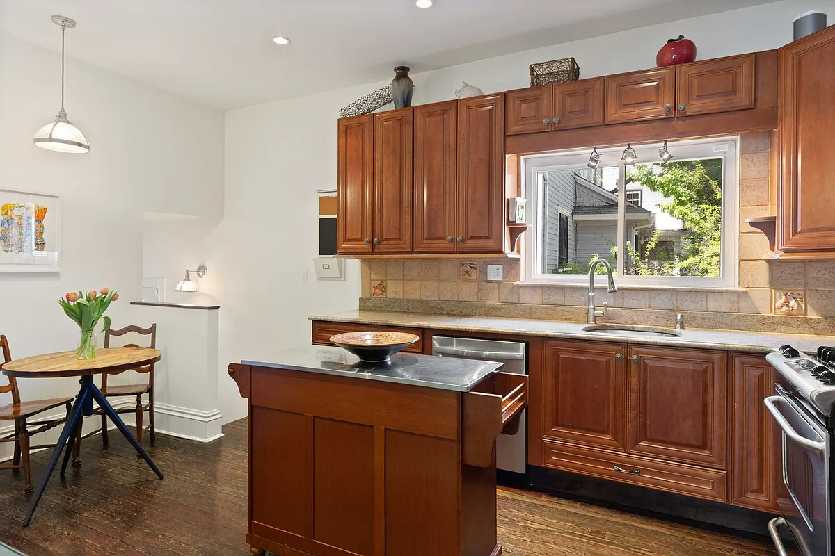 kitchen with wood cabinets, recessed lighting