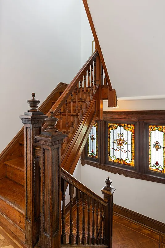 stair landing with stained glass windows
