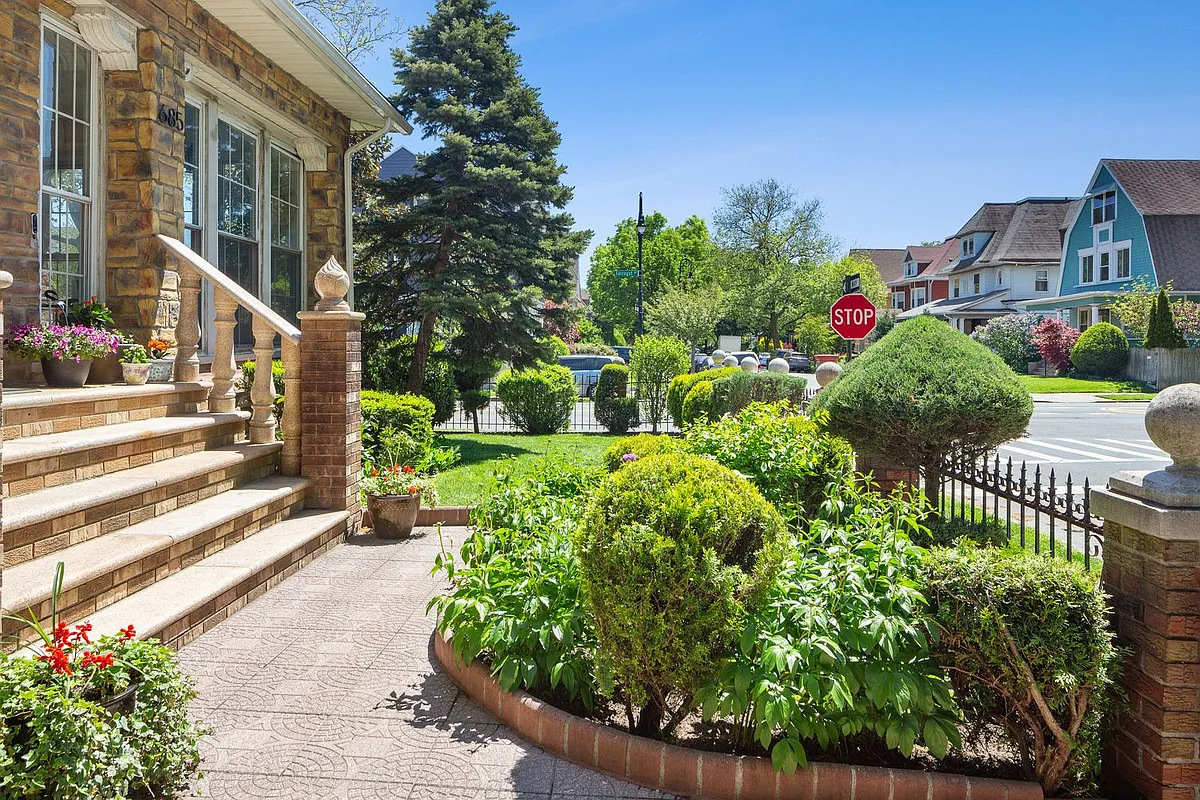 front yard with brick edged planting beds