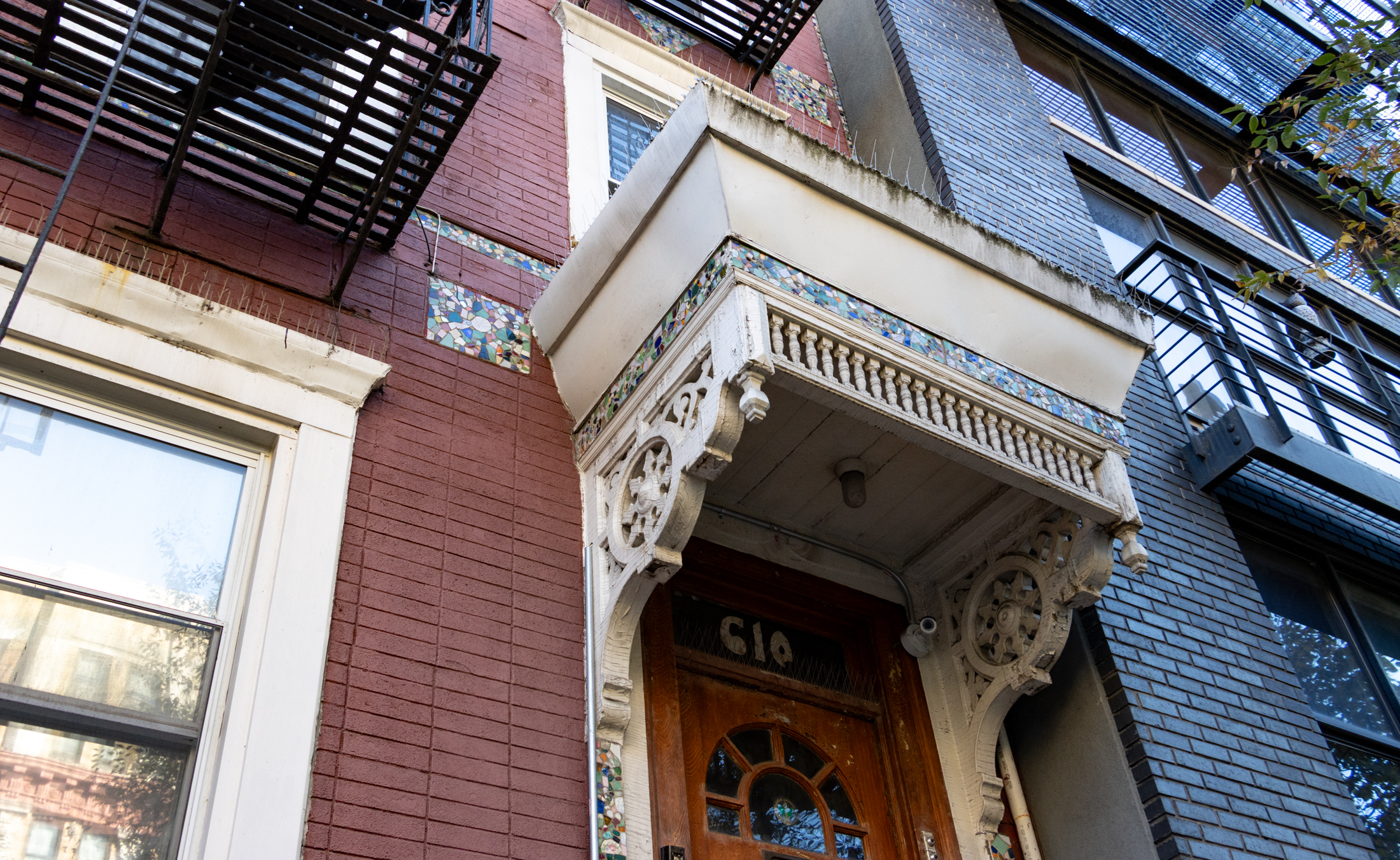wooden door hood with mosaics