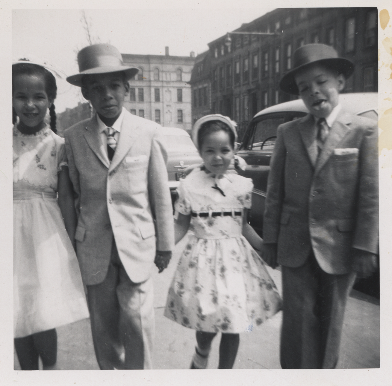 black and white photo of children in dresses and suits