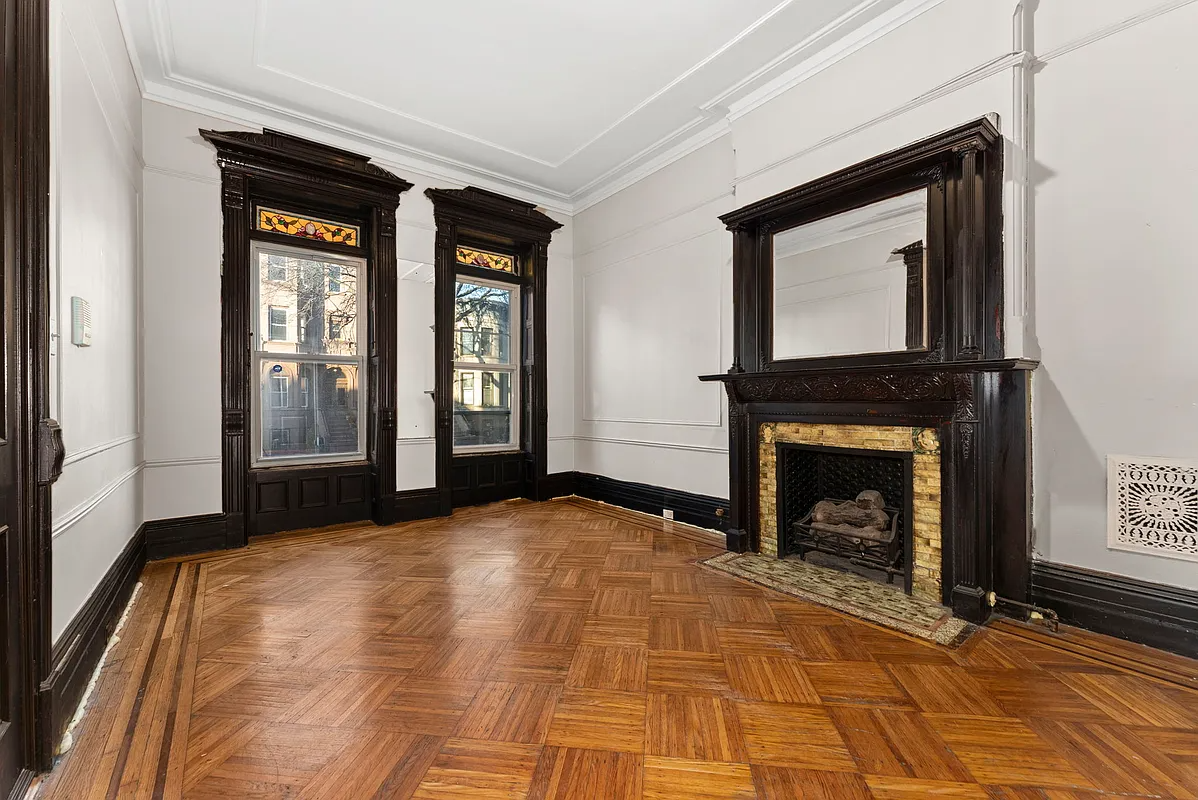 parlor with mantel and stained glass