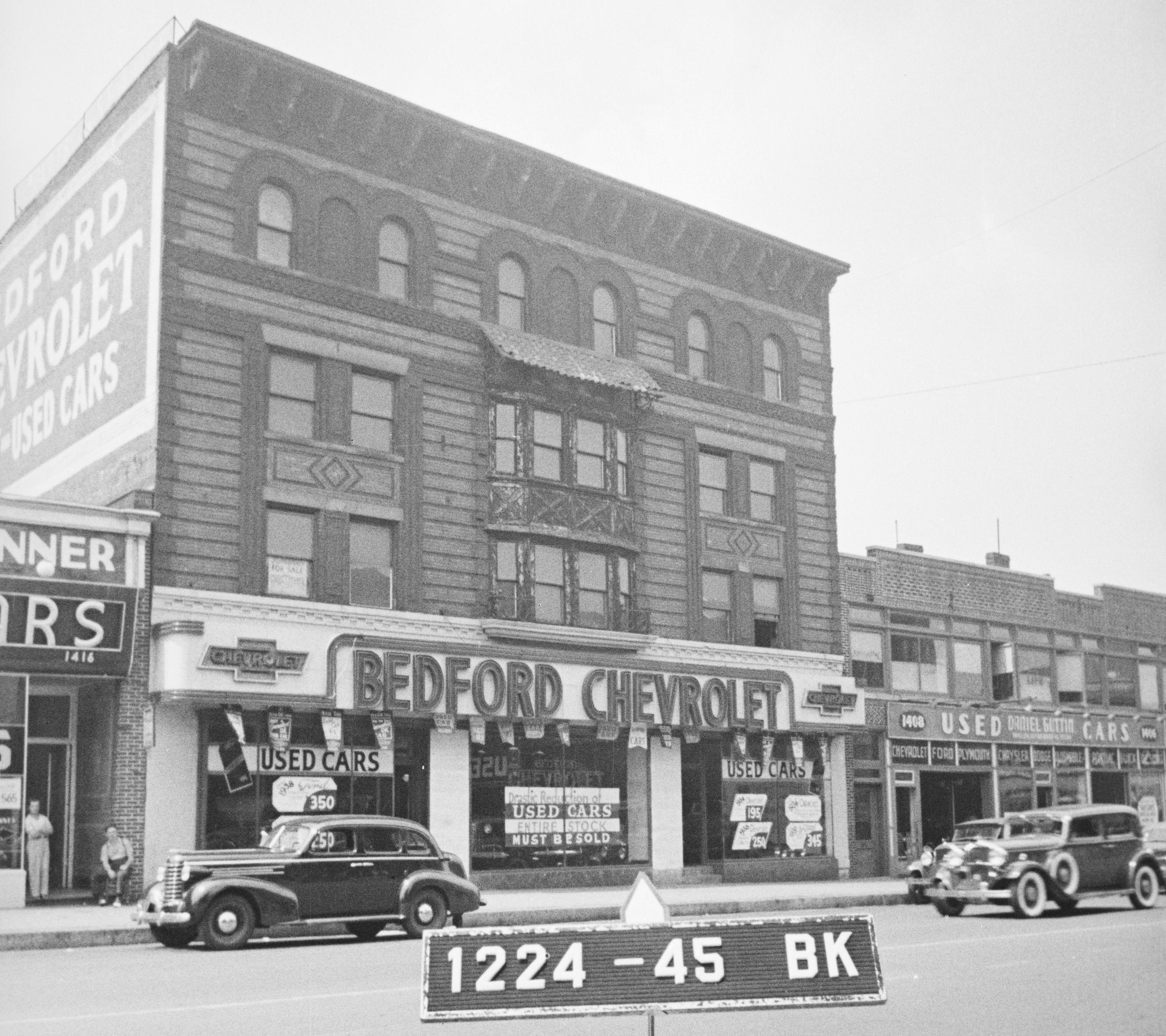black and white photo of  auto businesses