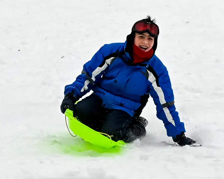 sledder on a hill