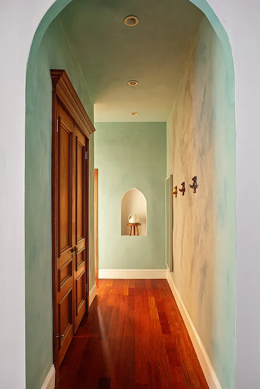 hall with green plaster walls
