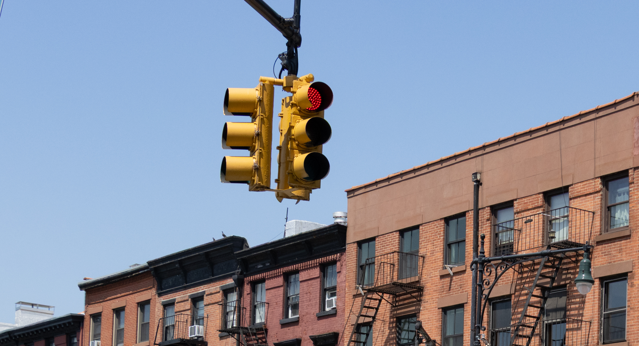 red light on atlantic avenue with buildings in the background