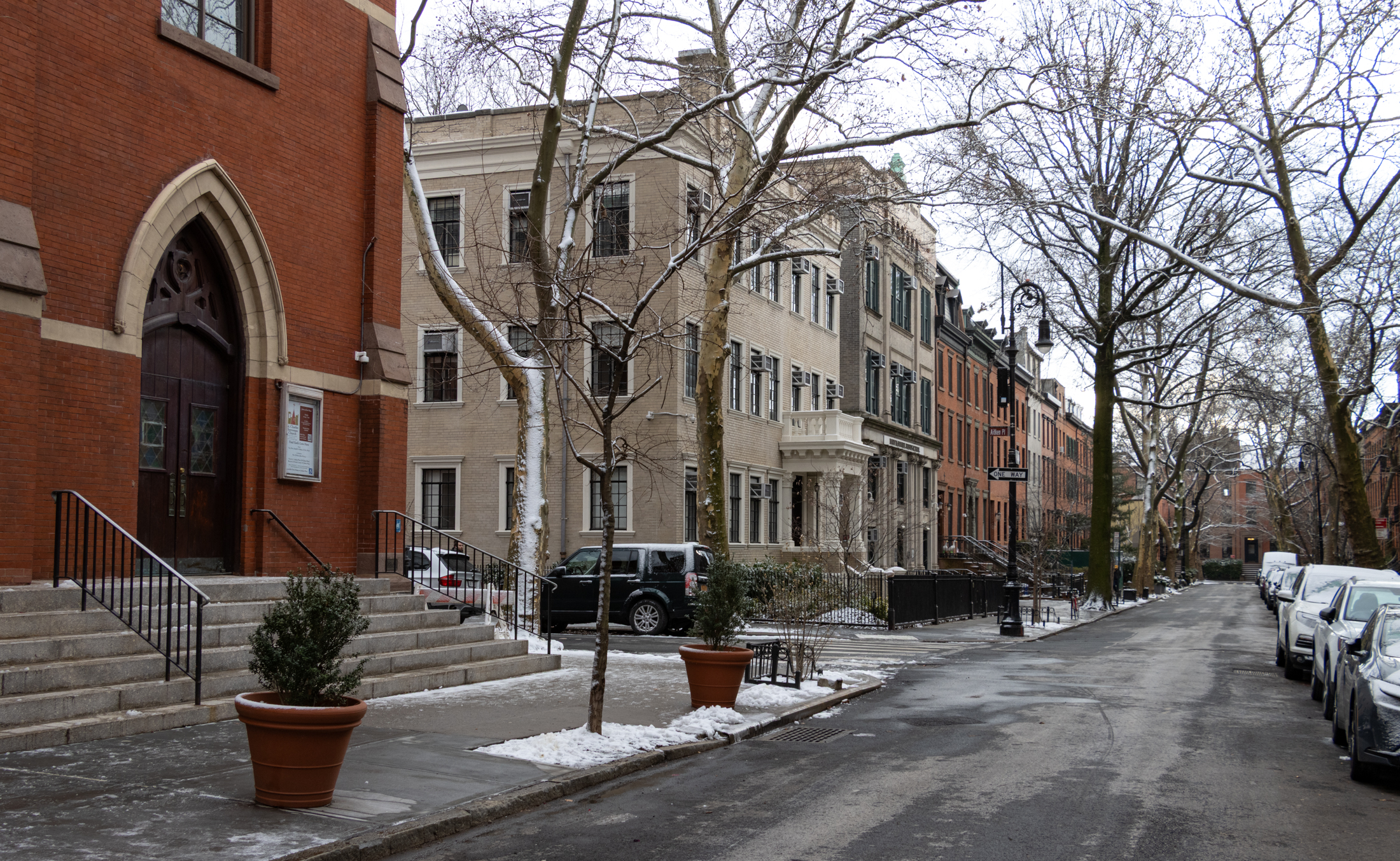 street scene in brooklyn heights with a church and row houses