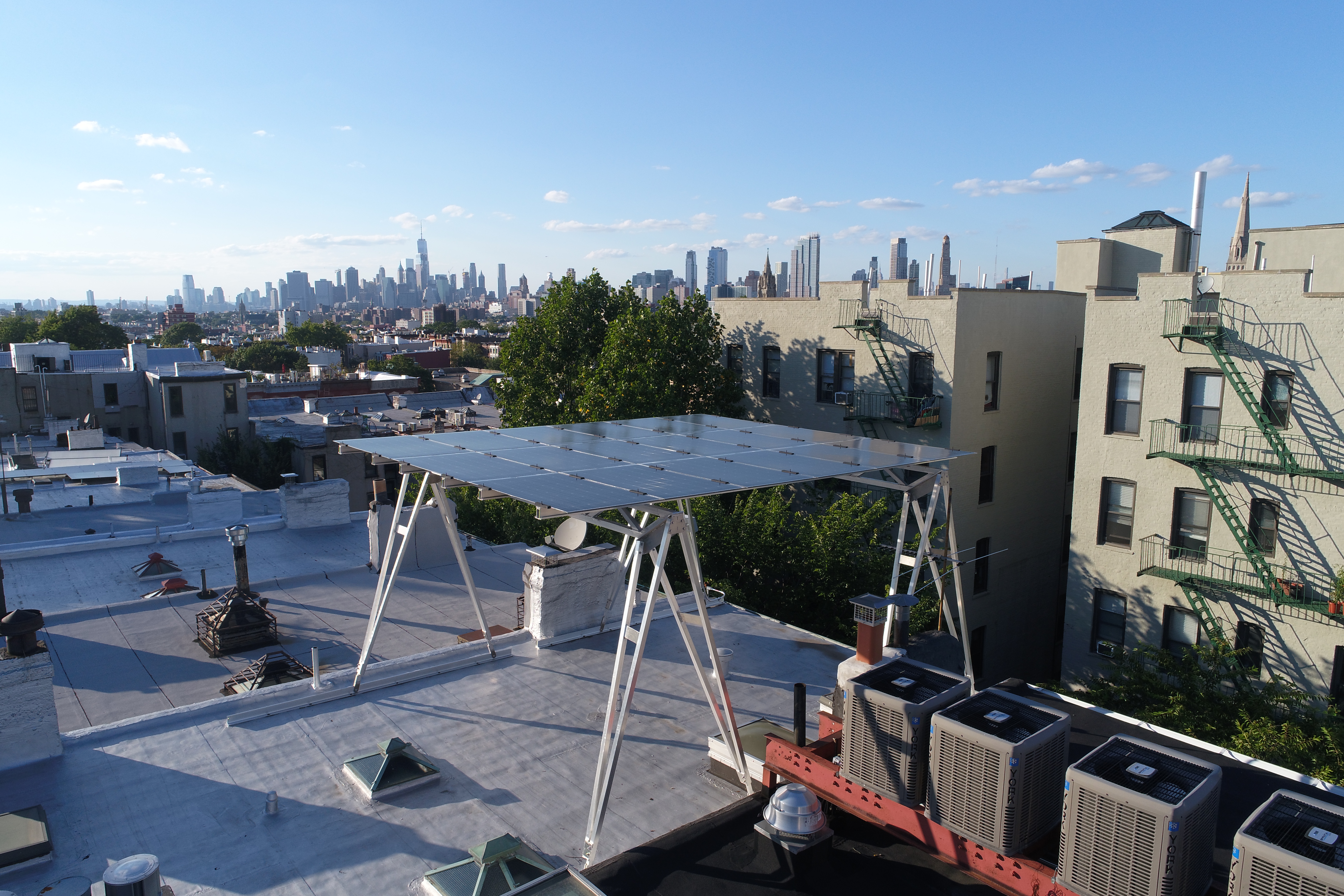 a solar panel installation atop a brooklyn rooftop