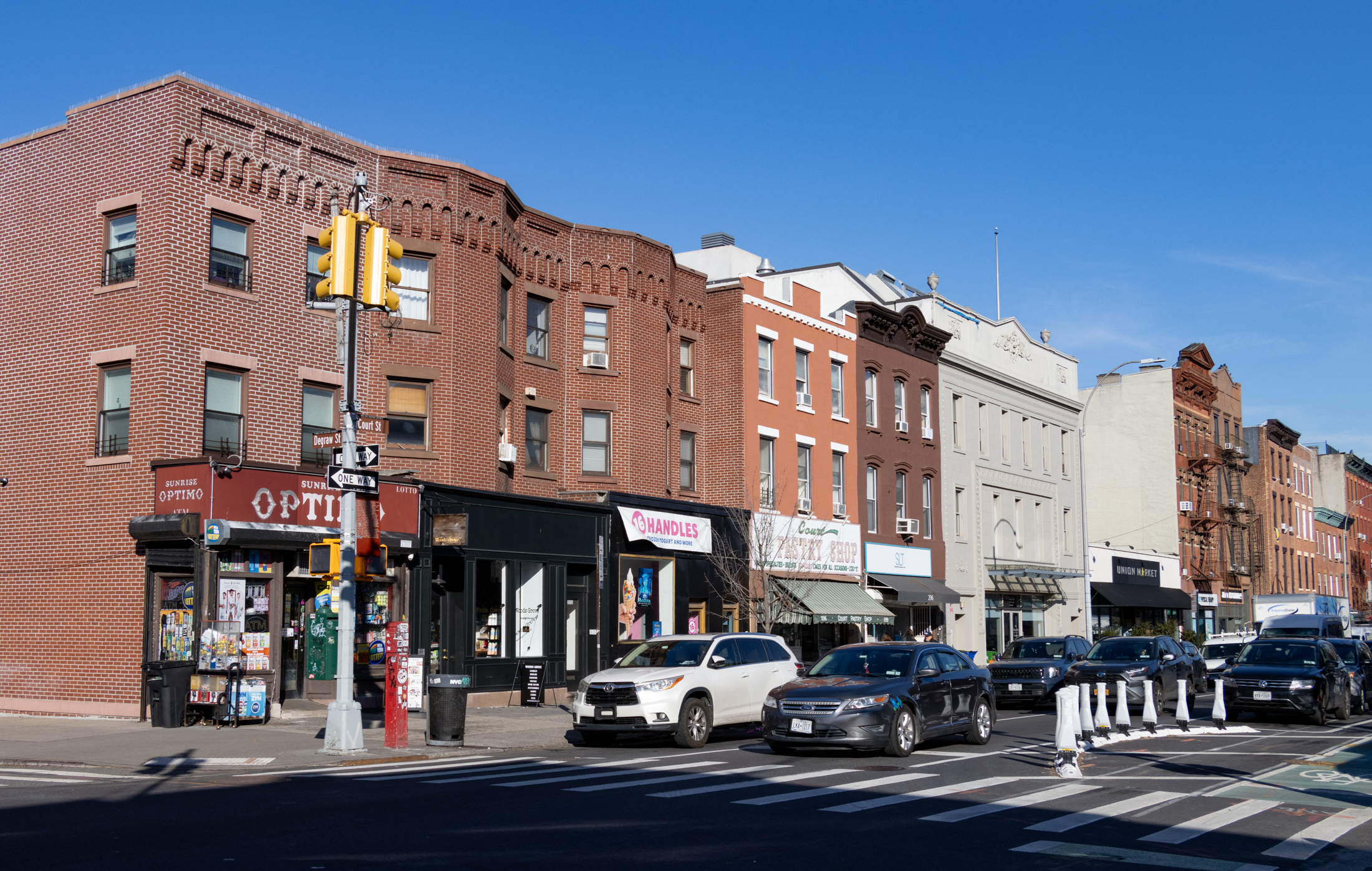 low scale buildings with storefronts including couth pastry shop