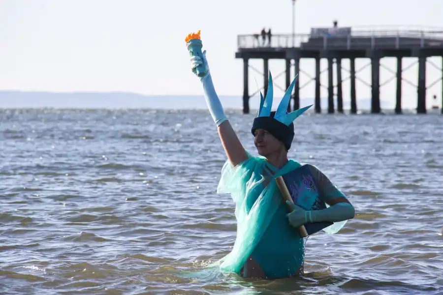 Lady Liberty stood tall beside the pier.