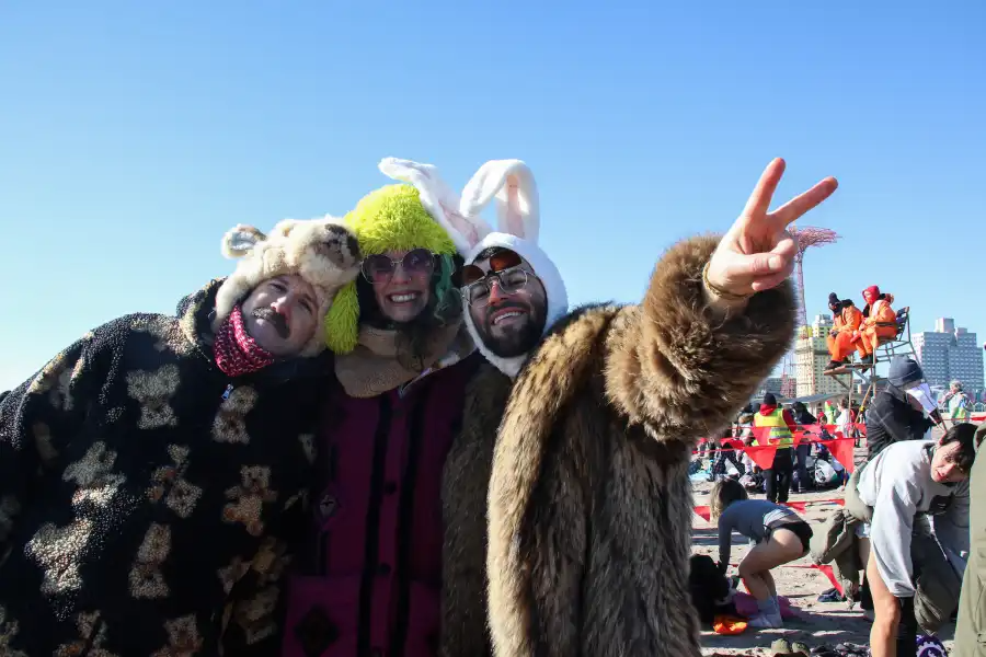 people posing on the beach