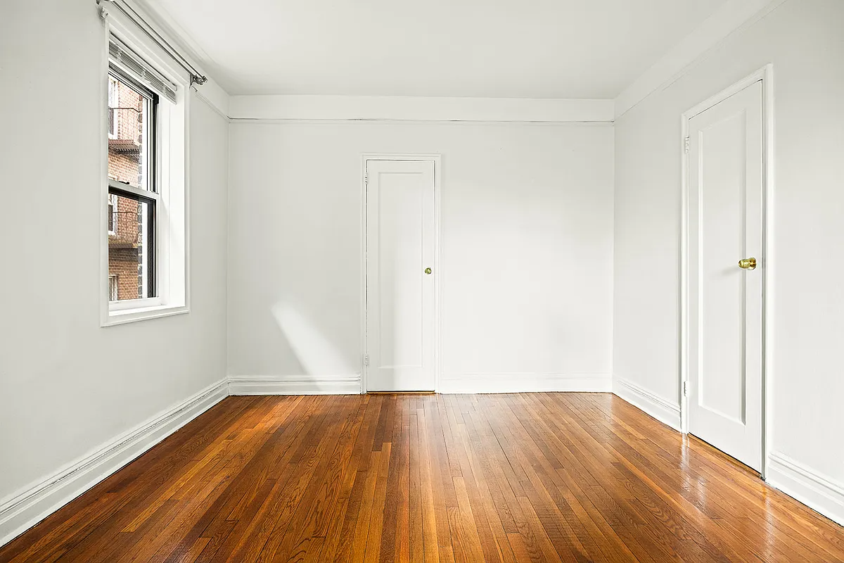 bedroom with closet, window