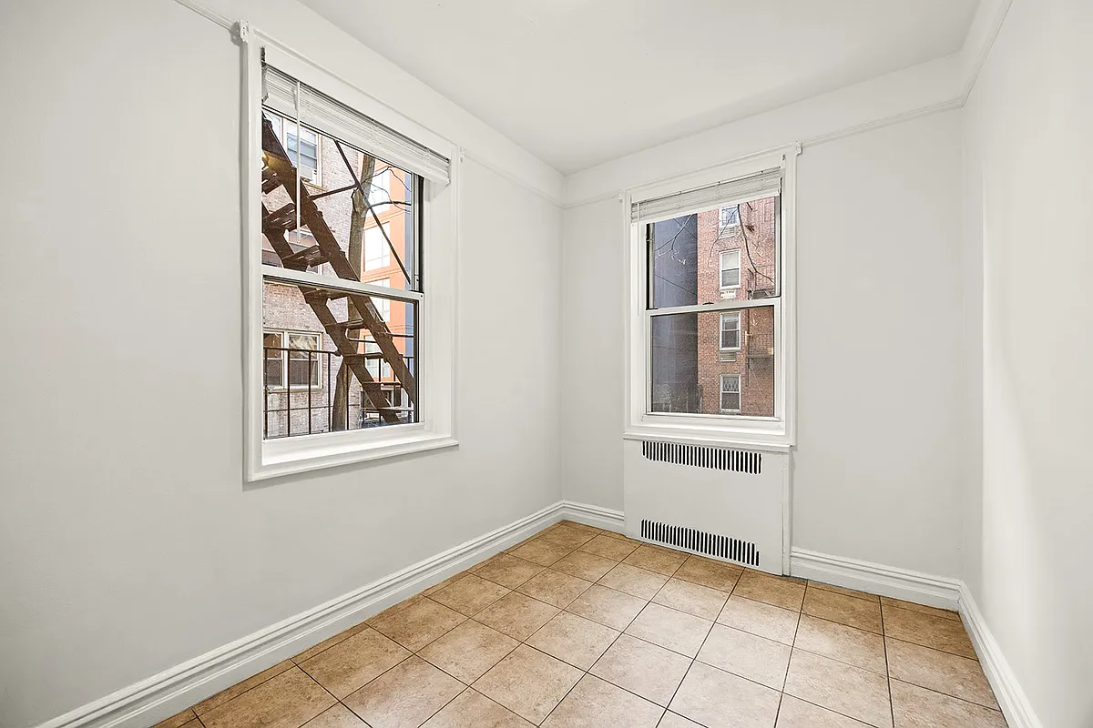 dining nook with tile floor, two exposures