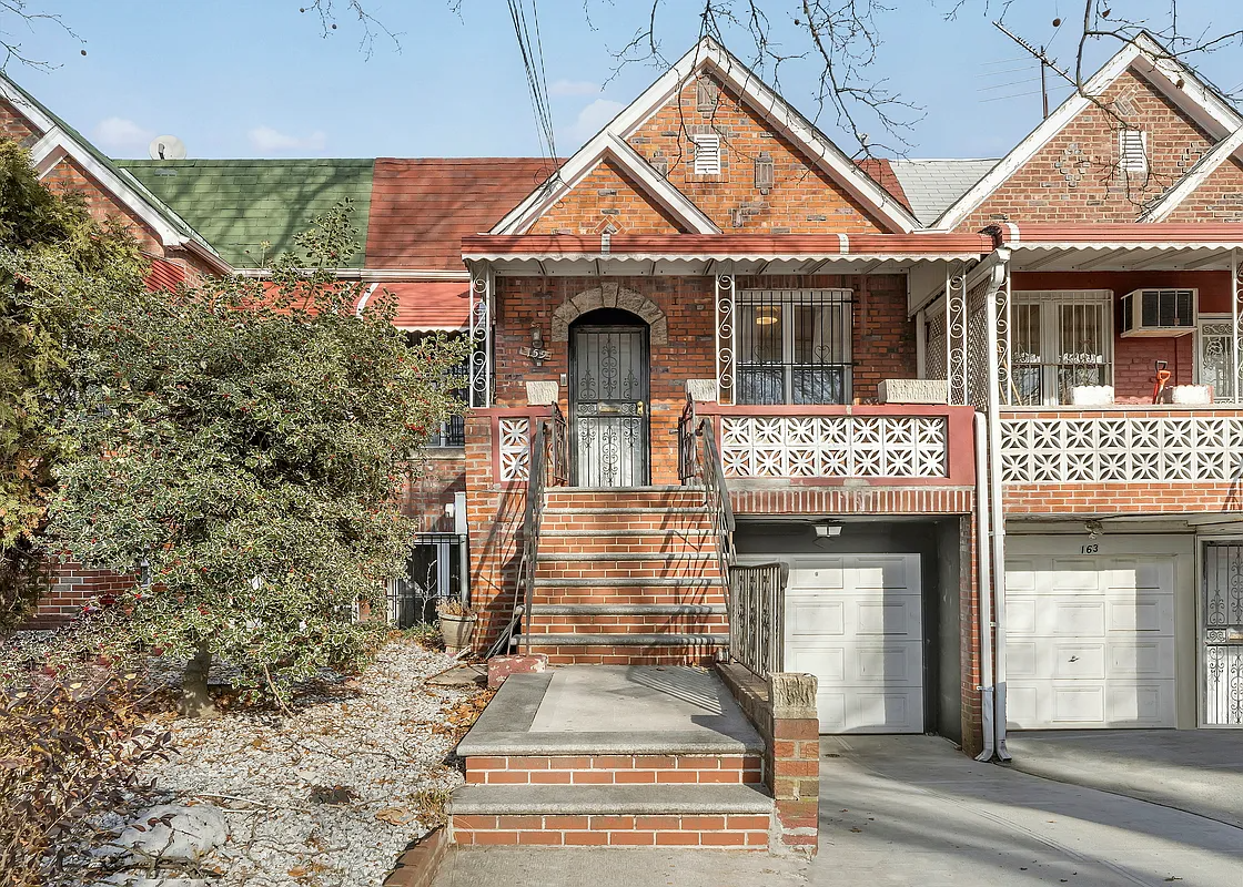 brick row house with garage