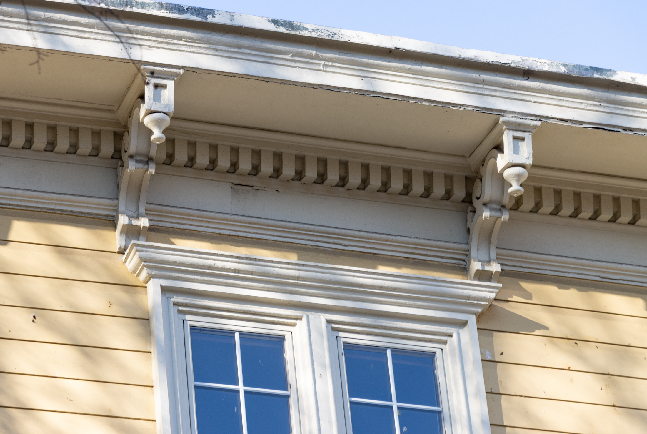 yellow wood frame house