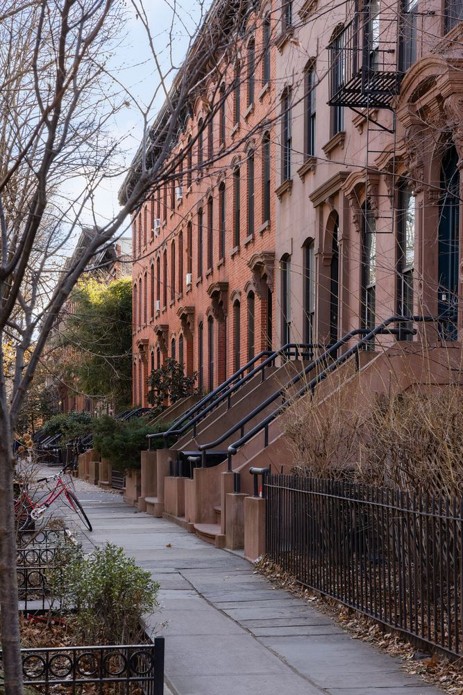 brick and brownstone row of houses