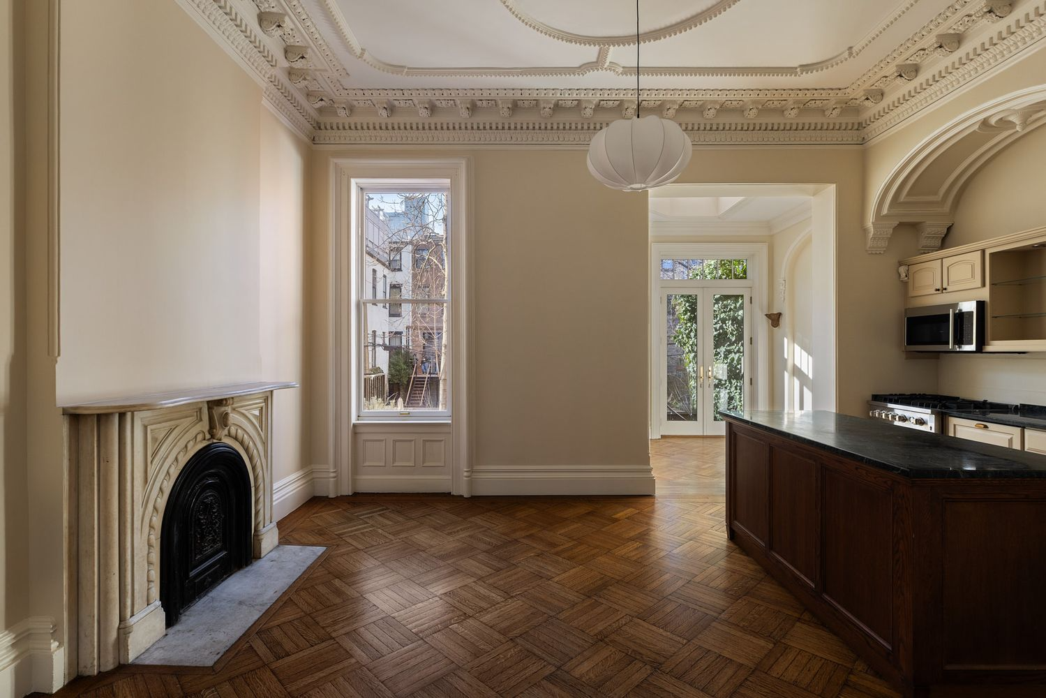 rear parlor with plasterwork, mantel